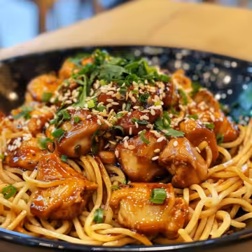 Sticky Garlic Chicken Noodles taken with iphone 15 pro max --iw 2 --ar 4:5 --v 6.0 --raw