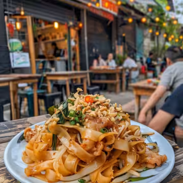 Street Style Thai Drunken Noodles taken with iphone 15 pro max --iw 2 --ar 4:5 --v 6.0 --raw