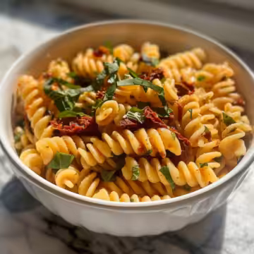 Sun-Dried Tomato Pasta Salad taken with iphone 15 pro max --iw 2 --ar 4:5 --v 6.0 --raw
