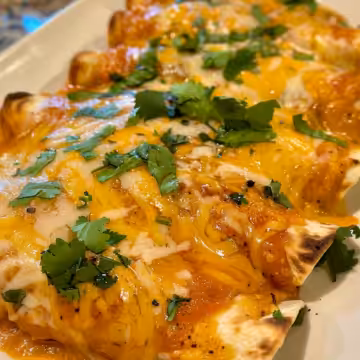 Tasty White Rotisserie Chicken Enchiladas taken with iphone 15 pro max --iw 2 --ar 4:5 --v 6.0 --raw
